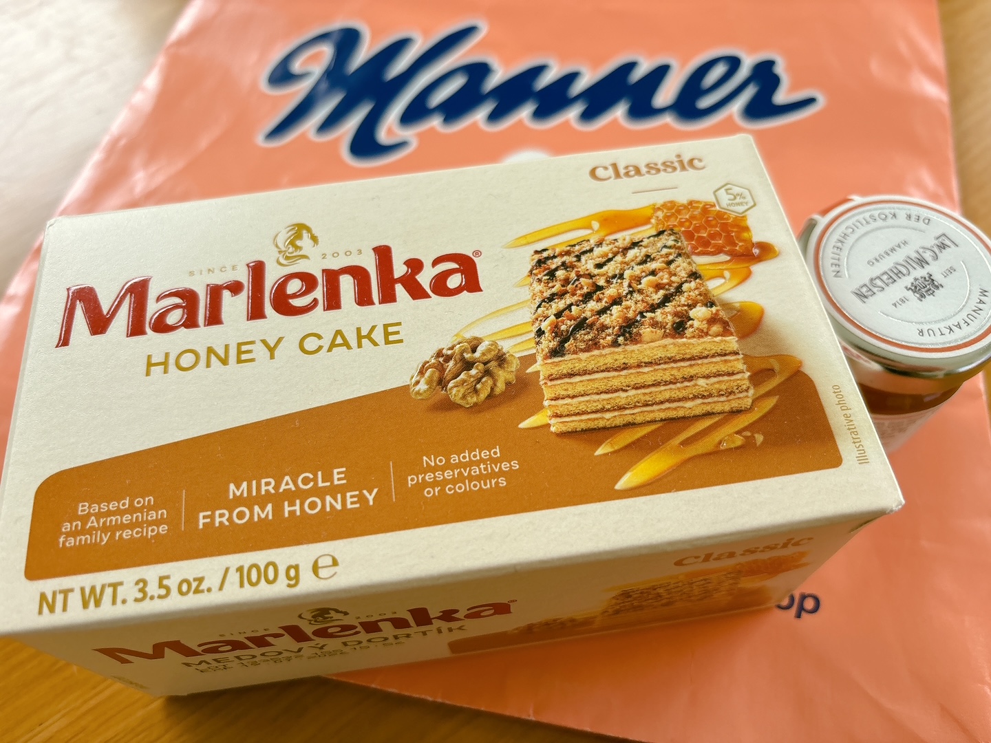 Box of Marlenka Honey Cake (Classic), showing a slice with honey drizzle and walnuts on the package image.